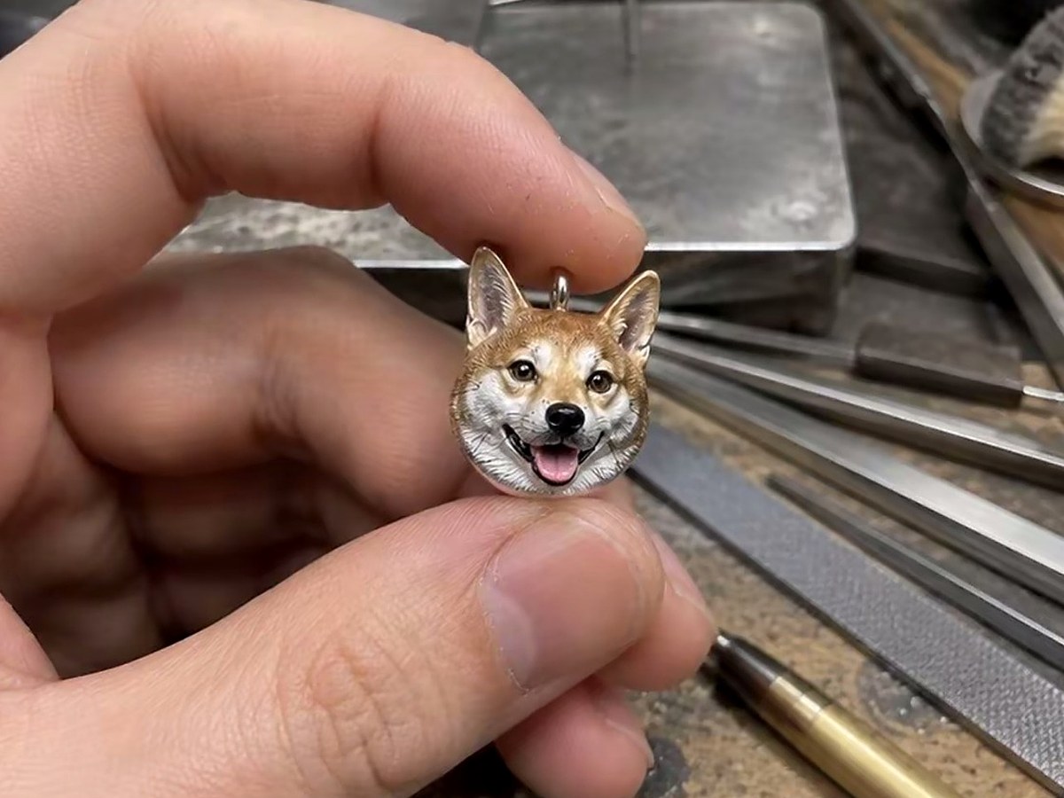tiny dog pendant closeup