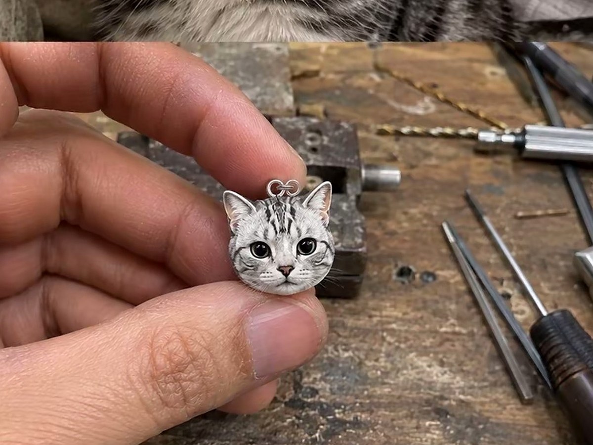 tiny cat pendant closeup